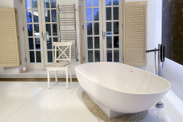 Bathroom-modern-white-marble-shutters-bath-garden-view-filming-location-hire-lodge-London-77