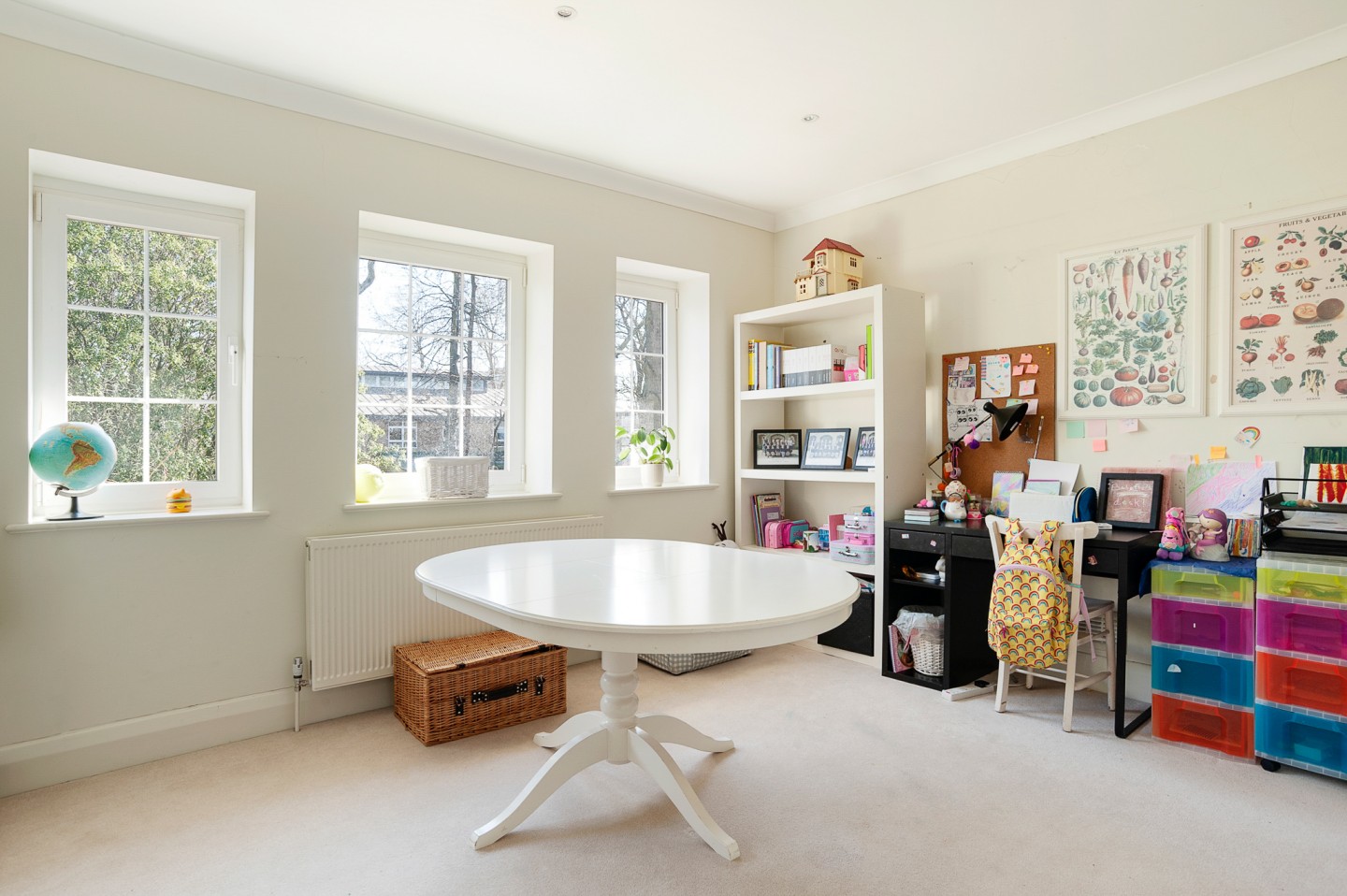 Light and modern teenager bedroom with shelving, table, drawers and wall hanging. Location hire for TV and filming in Park Lodge, London