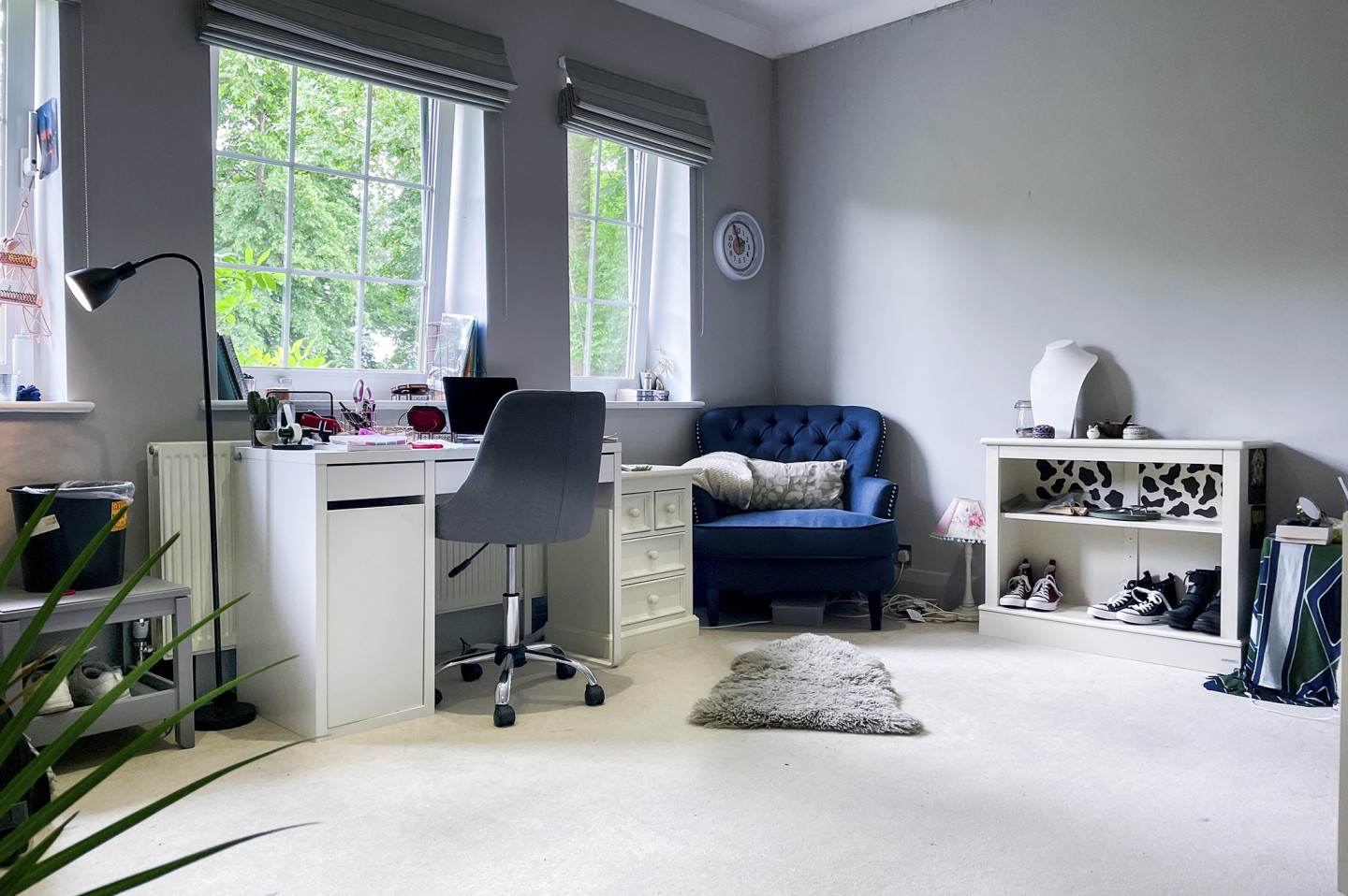 Modern teenage girl styled bedroom with study table, chairs, shelving and large windows. Location hire for TV and filming in Park Lodge, London