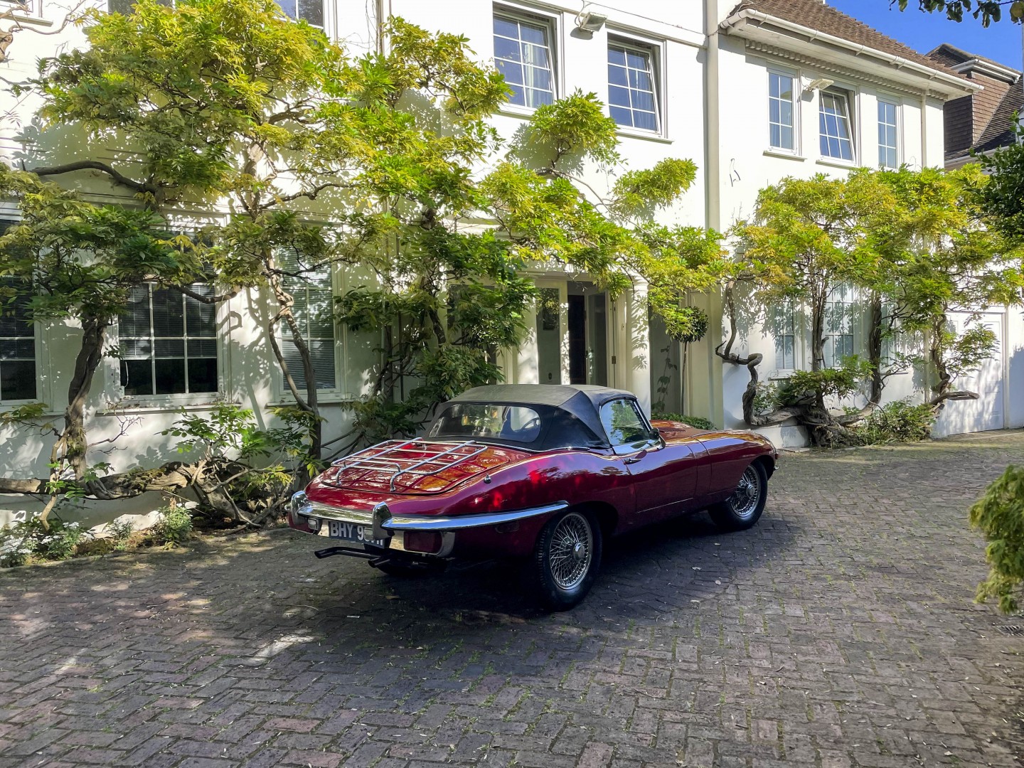 Classic car in wisteria driveway for TV and filming location hire in Park Lodge, London
