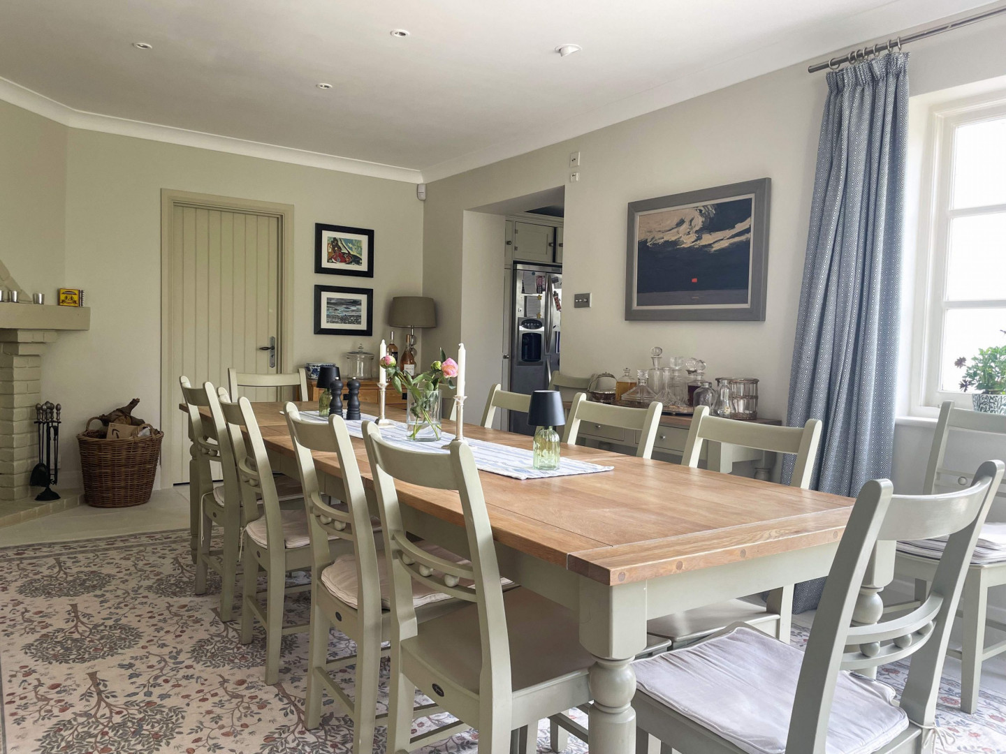 Dining-room-oak-table-paintings-windows-wine-rack-fireplace-cabinet-carpet-TV-filming-location-hire-lodge-London