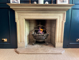 Fireplace-coal-burn-oak-panel-blue-fireplace-modern-oak-panelling-hearth-TV-filming-location-hire-lodge-London