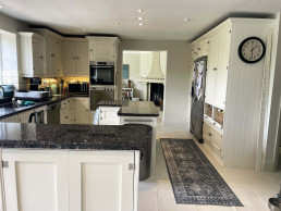 Kitchen-thru-dining-white-tile-floor-cooker-marble-worktops-TV-filming-location-hire-lodge-London