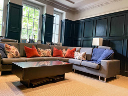 Lounge-room-sofa-blue-oak-panel-beige-carpet-modern-TV-filming-location-hire-lodge-London