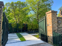 London film location North Lodge Hire for filming, TV, commercial, photoshoots, Luxury property London homes London real estate gated area entrance.