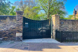 London film location North Lodge Hire for filming, TV, commercial, photoshoots, Luxury property London homes London real estate gated area entrance.