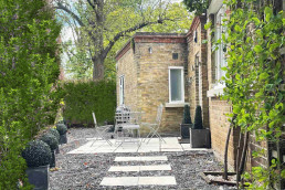 London film location North Lodge Hire for filming, TV, commercial, photoshoots, Luxury property London homes London real estate patio front garden.