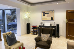 Sitting room with a garden view, glass door, work table and marble floor. Location hire for TV and filming in Park Lodge, London